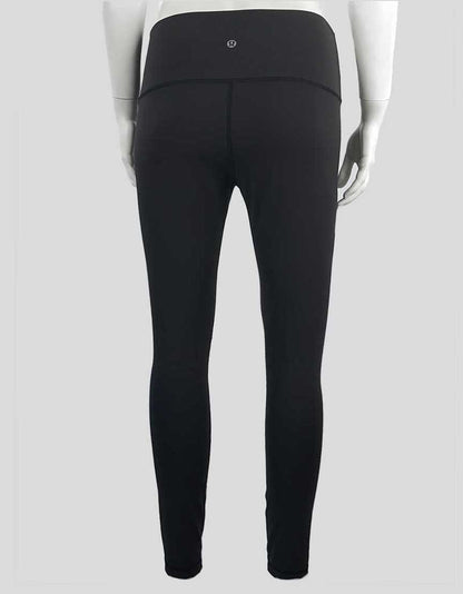 Lululemon Women's Medium Waisted Leggings In Dark Grey With Tonal Stitching Throughout Size 8 US