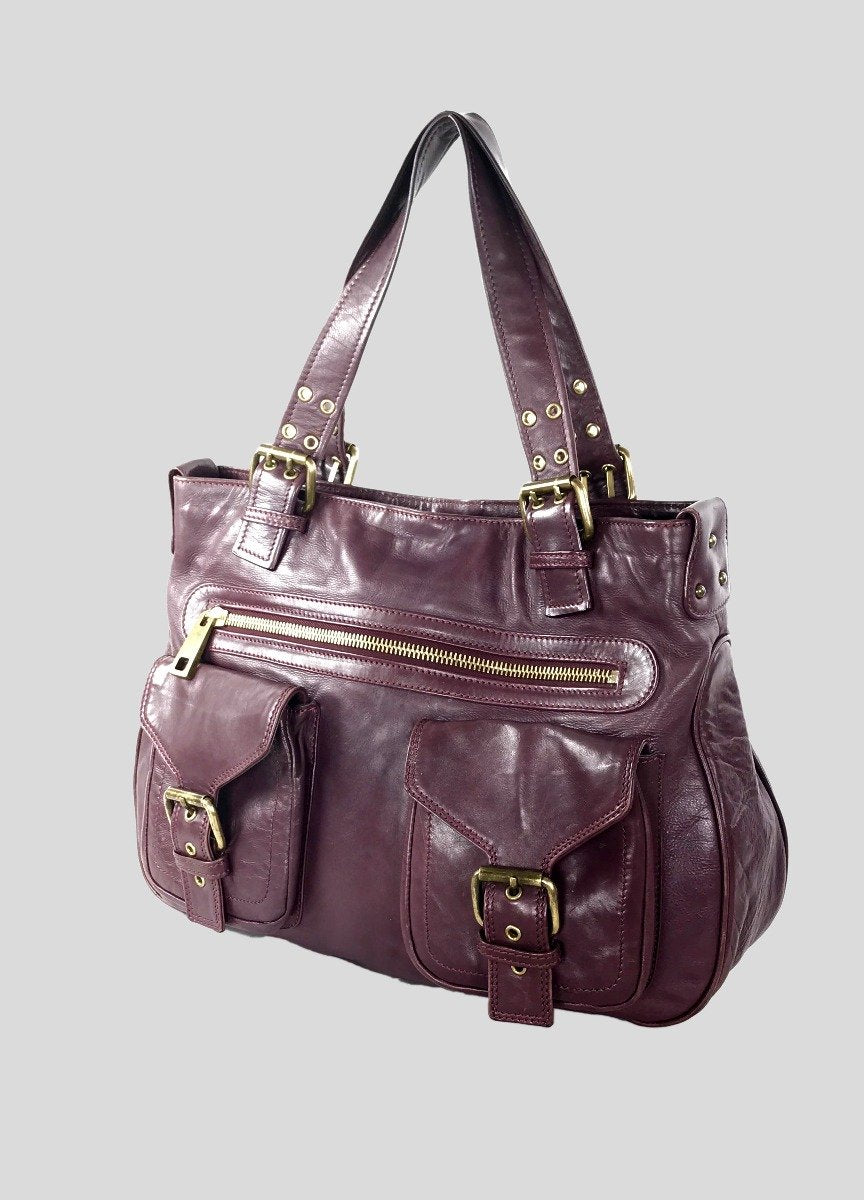 Marc Jacobs Stella Tote Bag With Front Buckle And Zipper Pockets In Burgundy Leather With Bronze Tone Hardware